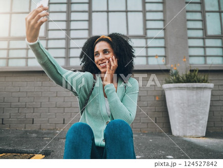 Phone, happy and woman taking a selfie on a street sidewalk outdoors to post online for social media. Smile, student and young girl enjoys taking pictures alone and posting them on a social network Phone, happy and woman taking a selfie on a street sidewalk outdoors to post online for social media. Smile, student and young girl enjoys taking pictures alone and posting them on a social network 124527842