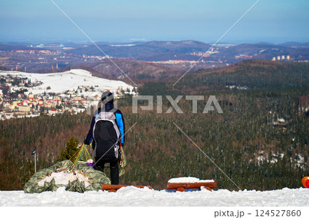 Paraglider preparing for winter mountain flight Paraglider preparing for winter mountain flight 124527860