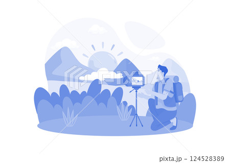 A photographer captures sunrise shots at a scenic location. 124528389