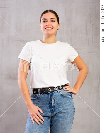 Smiling young woman posing in casual clothes Smiling young woman posing in casual clothes 124530377