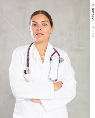 Young woman posing in medical uniform in studio Young woman posing in medical uniform in studio 124530613
