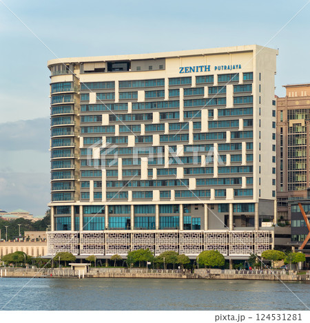 Modern architectural marvel at Zenith Putrajaya hotel in Malaysia, overlooking serene waters Modern architectural marvel at Zenith Putrajaya hotel in Malaysia, overlooking serene waters 124531281