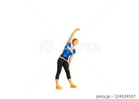 A figurine of a woman in workout attire performing a side stretch isolated on white background with clipping path A figurine of a woman in workout attire performing a side stretch isolated on white background with clipping path 124534557