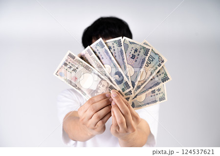 Japanese Yen notes fanned out illustrate global monetary transactions and international trade dynamics Japanese Yen notes fanned out illustrate global monetary transactions and international trade dynamics 124537621