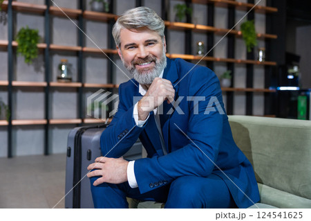 Bearded caucasian well-dressed business man looking confident and determined 124541625