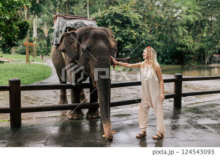 beautiful girl with smiling elephant, elephant village, bali 124543093