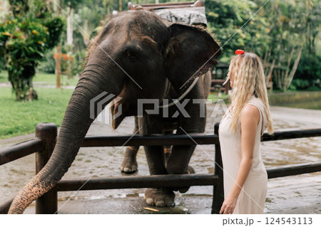 beautiful girl with smiling elephant, elephant village, bali 124543113
