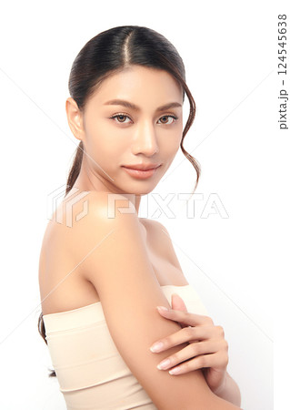 A beautiful young Asian woman with clean, fresh skin against a white background. Skincare, facial treatment, cosmetology, beauty, and spa. An elegant portrait of an Asian woman. A beautiful young Asian woman with clean, fresh skin against a white background. Skincare, facial treatment, cosmetology, beauty, and spa. An elegant portrait of an Asian woman. 124545638