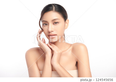 A beautiful young Asian woman with clean, fresh skin against a white background. Skincare, facial treatment, cosmetology, beauty, and spa. An elegant portrait of an Asian woman. A beautiful young Asian woman with clean, fresh skin against a white background. Skincare, facial treatment, cosmetology, beauty, and spa. An elegant portrait of an Asian woman. 124545656