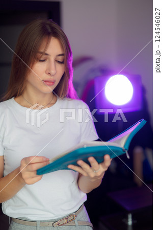 Bible, woman 20s study and writing, notes on religion at desk in home, Christian faith and knowledge of God. Reading, hope and girl holy book, learning gospel inspiration prayer in a white T-shirt Bible, woman 20s study and writing, notes on religion at desk in home, Christian faith and knowledge of God. Reading, hope and girl holy book, learning gospel inspiration prayer in a white T-shirt 124546027