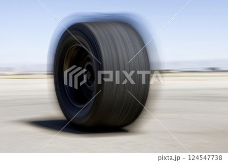 Rapid Motion Blur Effect of Spinning Wheel in Clear Outdoor Environment Rapid Motion Blur Effect of Spinning Wheel in Clear Outdoor Environment 124547738