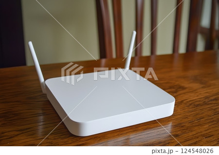 Modern White Wireless Router for Internet Connection on Wooden Table Surface Modern White Wireless Router for Internet Connection on Wooden Table Surface 124548026