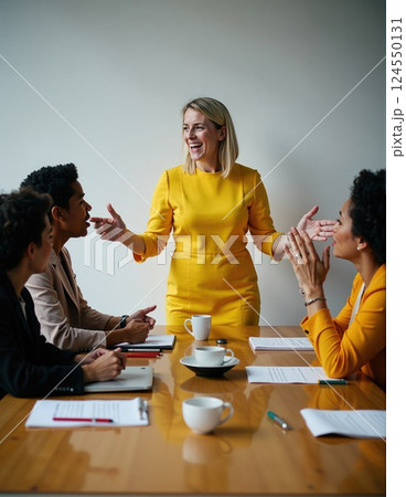 Female leader engaging team in business meeting with positive interaction 124550131