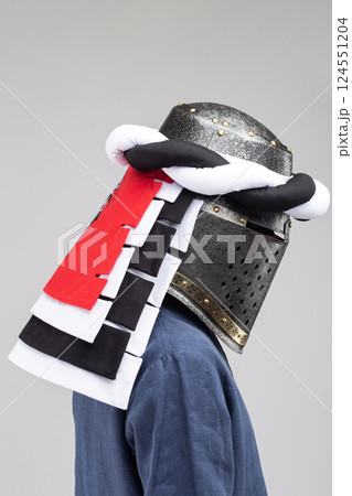 Medieval Knight Helmet with White and Black Drapery Medieval Knight Helmet with White and Black Drapery 124551204