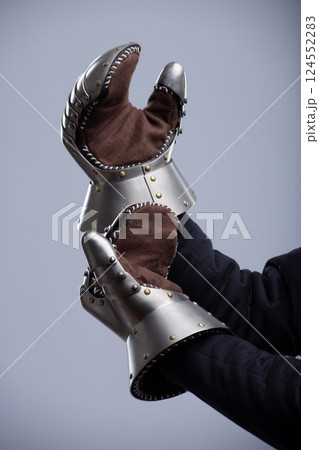 Person Wearing Medieval Gauntlets Showing Palms 124552283