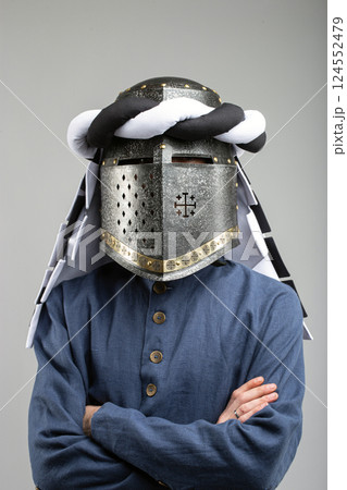 Medieval Knight Helmet with White and Black Drapery Medieval Knight Helmet with White and Black Drapery 124552479