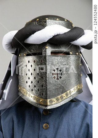 Medieval Knight Helmet with White and Black Drapery 124552480