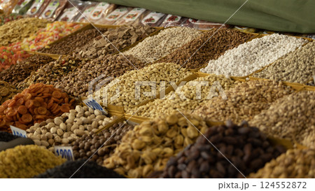 folk container with dried nut which is the souvenir for tourists in Osh Bazaar. Osh Bazaar is one of biggest bazaar in Kyrgyzstan. folk container with dried nut which is the souvenir for tourists in Osh Bazaar. Osh Bazaar is one of biggest bazaar in Kyrgyzstan. 124552872