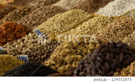 folk container with dried nut which is the souvenir for tourists in Osh Bazaar. Osh Bazaar is one of biggest bazaar in Kyrgyzstan. folk container with dried nut which is the souvenir for tourists in Osh Bazaar. Osh Bazaar is one of biggest bazaar in Kyrgyzstan. 124552873