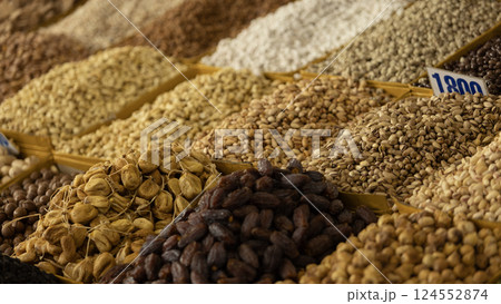 folk container with dried nut which is the souvenir for tourists in Osh Bazaar. Osh Bazaar is one of biggest bazaar in Kyrgyzstan. folk container with dried nut which is the souvenir for tourists in Osh Bazaar. Osh Bazaar is one of biggest bazaar in Kyrgyzstan. 124552874
