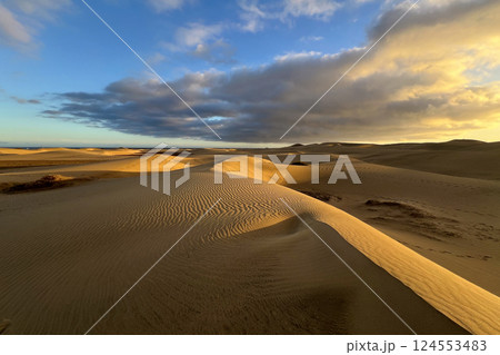 A colorful sunset at a Maspalomas dune, Gran Canaria island A colorful sunset at a Maspalomas dune, Gran Canaria island 124553483