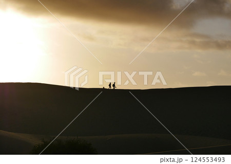 A colorful sunset at a Maspalomas dune, Gran Canaria island A colorful sunset at a Maspalomas dune, Gran Canaria island 124553493