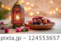 Traditional Lantern with Dates and Flowers on a Soft Background 124553657