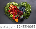 Heart shape made of fresh vegetables on dark background. Healthy food concept. top view 124554065