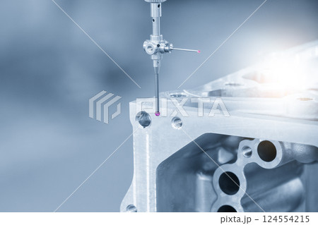 The CMM machine measuring the aluminum cylinder head parts by modular probe in the light blue scene. 124554215