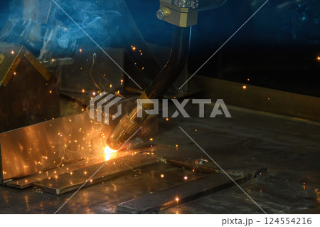 Close up scene the laser welding process by hand held laser welding machine. 124554216