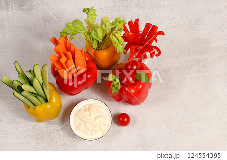 Raw food concept and diet food, Vegetable sticks in bell peppers and sauce for weight loss, intermittent fasting. Healthy breakfast with ingredients, menu for cafe or restaurant, kitchen background, Raw food concept and diet food, Vegetable sticks in bell peppers and sauce for weight loss, intermittent fasting. Healthy breakfast with ingredients, menu for cafe or restaurant, kitchen background, 124554395