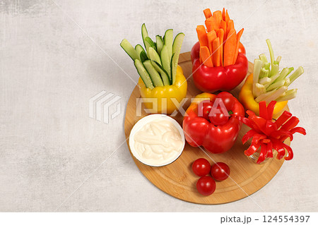 Raw food concept and diet food, Vegetable sticks in bell peppers and sauce for weight loss, intermittent fasting. Healthy breakfast with ingredients, menu for cafe or restaurant, kitchen background, Raw food concept and diet food, Vegetable sticks in bell peppers and sauce for weight loss, intermittent fasting. Healthy breakfast with ingredients, menu for cafe or restaurant, kitchen background, 124554397
