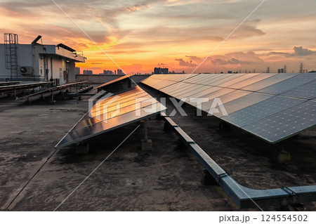 Solar panels on roof top of building with sunset sky at dusk, Bangkok 124554502