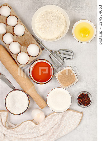 Kitchen background of food preparation.Culinary ingredients for making pie and bread,recipe with eggs,flour,sugar,honey,cinnamon,yeast and butter.Concept of modern bakery, Kitchen background of food preparation.Culinary ingredients for making pie and bread,recipe with eggs,flour,sugar,honey,cinnamon,yeast and butter.Concept of modern bakery, 124554663