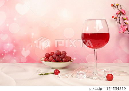 Modern still life with glass of red wine, orange slices, ice and grapes on elegant background with sakura flowers, minimalist bar and summer party concept, advertising banner and menu for cafe Modern still life with glass of red wine, orange slices, ice and grapes on elegant background with sakura flowers, minimalist bar and summer party concept, advertising banner and menu for cafe 124554859
