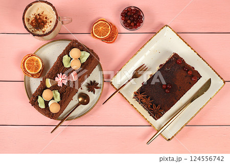 Concept of modern bakery, festive treat. Homemade delicious tiramisu, sponge cake or cake with sweet jam, cream, nuts, cinnamon and milk drink eggnog with cocoa. And advertising for cafe and Concept of modern bakery, festive treat. Homemade delicious tiramisu, sponge cake or cake with sweet jam, cream, nuts, cinnamon and milk drink eggnog with cocoa. And advertising for cafe and 124556742