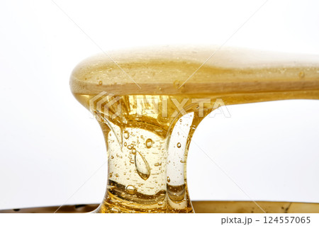 Photo of a sugar paste for depilation hair removal procedure. Texture. 124557065