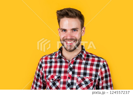nice smile. stylish male wear casual clothes. bearded man with bristle on unshaven face. fashion and beauty. barbershop concept. mens wear. young handsome guy in red checkered shirt nice smile. stylish male wear casual clothes. bearded man with bristle on unshaven face. fashion and beauty. barbershop concept. mens wear. young handsome guy in red checkered shirt 124557237