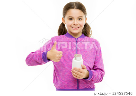Vitamin concept. Need vitamin supplements. Healthy lifestyle. Health care. Investment into health. Take vitamin supplements. Child take medicines. Treatment and medicine. Girl hold medicines bottle 124557546