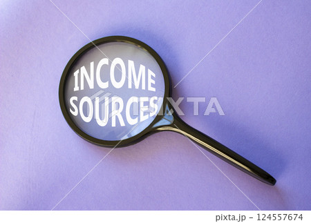 Income Sources symbol. Magnifying Glass with Concept word Income Sources. Beautiful purple background. Business and Income Sources concept. Copy space Income Sources symbol. Magnifying Glass with Concept word Income Sources. Beautiful purple background. Business and Income Sources concept. Copy space 124557674