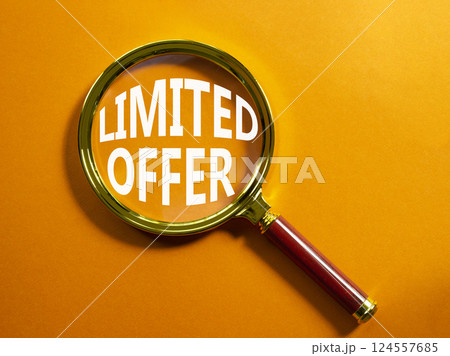 Limited Offer symbol. Magnifying Glass with Concept word Limited Offer. Beautiful orange background. Business and Limited Offer concept. Copy space 124557685