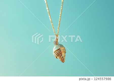 Elegant golden ice cream cone necklace on a light blue background. White gold ice cream cone jewelry pendant. Sweets and fast fashion concept. Rip diet, creative jewelry. Summer vibes, holidays. 124557986
