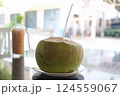 Tropical Refreshment : Fresh Coconut Drink on a Cafe Table 124559067