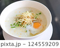 Savory Congee with Egg and Fresh Garnishes 124559209