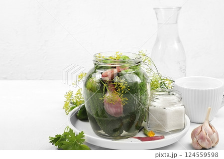 Cucumbers, dill, garlic, currant leaves, cherry, horseradish, oak and basil, rustic pickling recipe, Cucumbers and ingredients for pickling them, home canning concept, healthy and natural 124559598