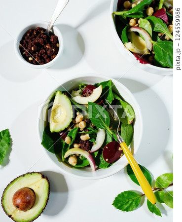 Fresh vegan power bowl with avocado, spinach, and chickpeas for a healthy lifestyle meal prep design 124559986