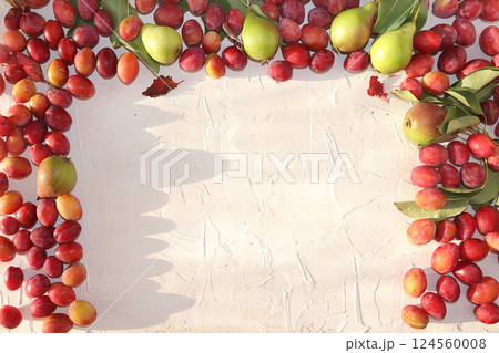 Pear and plum on a sunny table, summer banner, concept of healthy and natural food, diet detox, slimming, top view, flat lay, selective focus, source of vitamins, place for text 124560008
