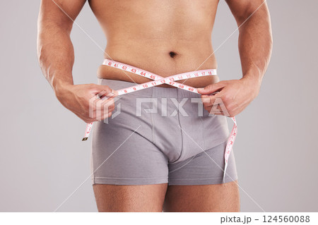 Weight loss, fitness and health with tape measure and man for wellness, training and sports achievement. Gym, lose weight and diet with stomach of guy for exercise, workout and body wellbeing Weight loss, fitness and health with tape measure and man for wellness, training and sports achievement. Gym, lose weight and diet with stomach of guy for exercise, workout and body wellbeing 124560088