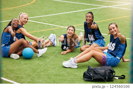 Sport, fitness and girl netball team on field, training and exercise with athlete thumbs up portrait. Young, active and player ready for game, diversity in sports and happy teamwork outdoor. 124560100