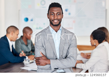 Leadership, meeting and planning with a black man and his business team in the boardroom for strategy. Portrait, leader and collaboration with a male manager standing arms crossed in his office 124560137